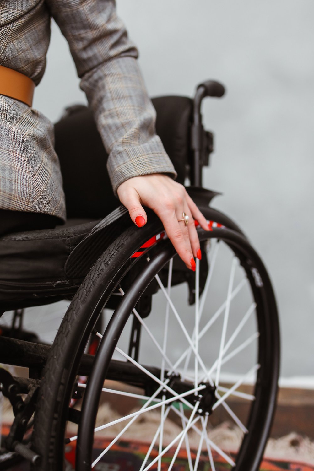 Hand of Woman on Wheelchair